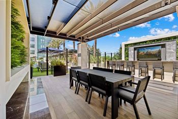 Expansive social courtyards with fire pits, grills, and open-air dining
